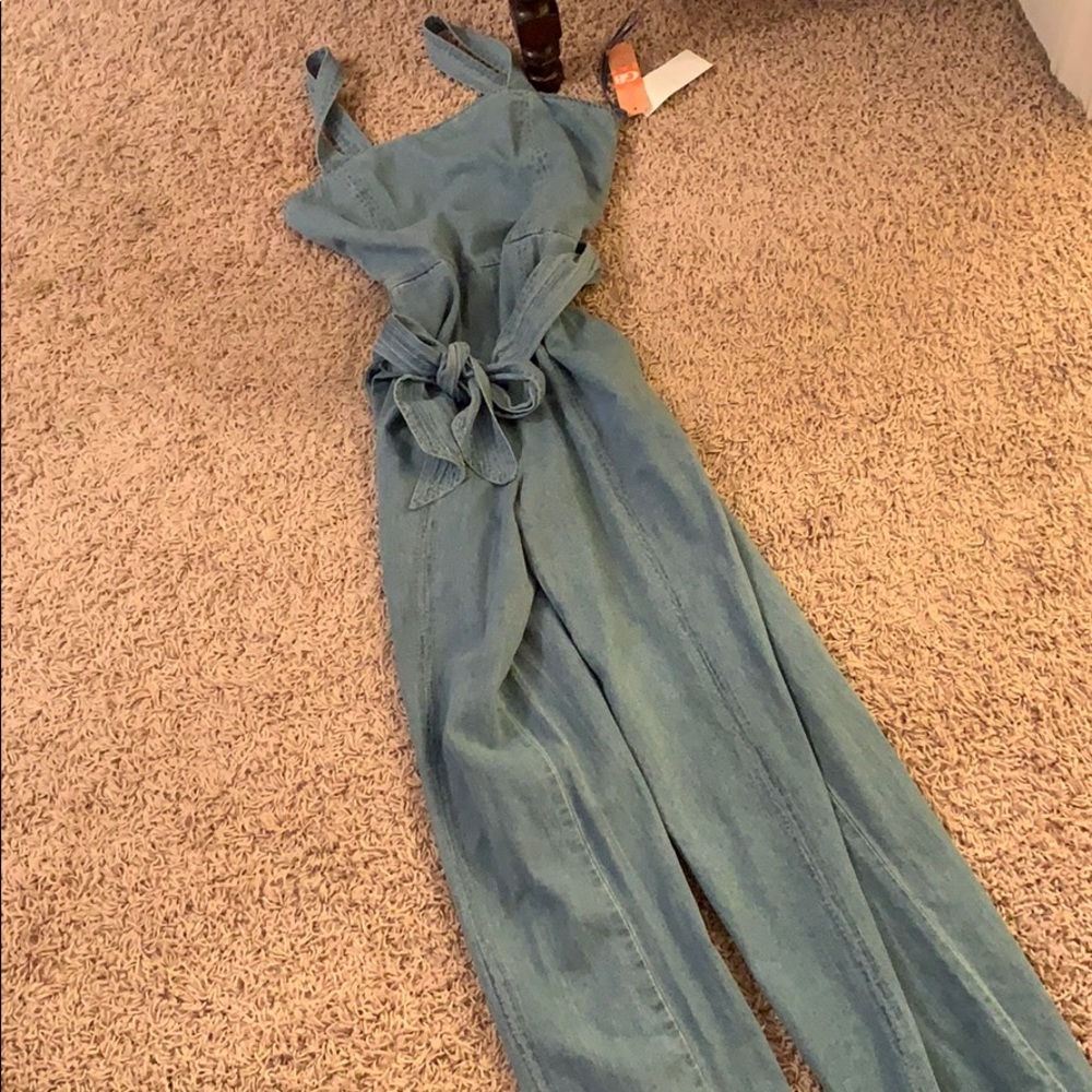 denim overalls w a bow tie in the front